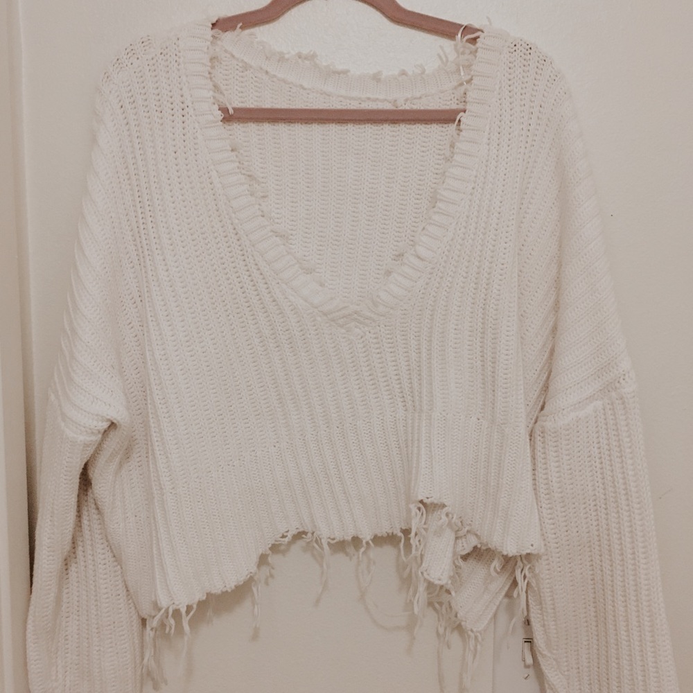 Distressed crop sweater